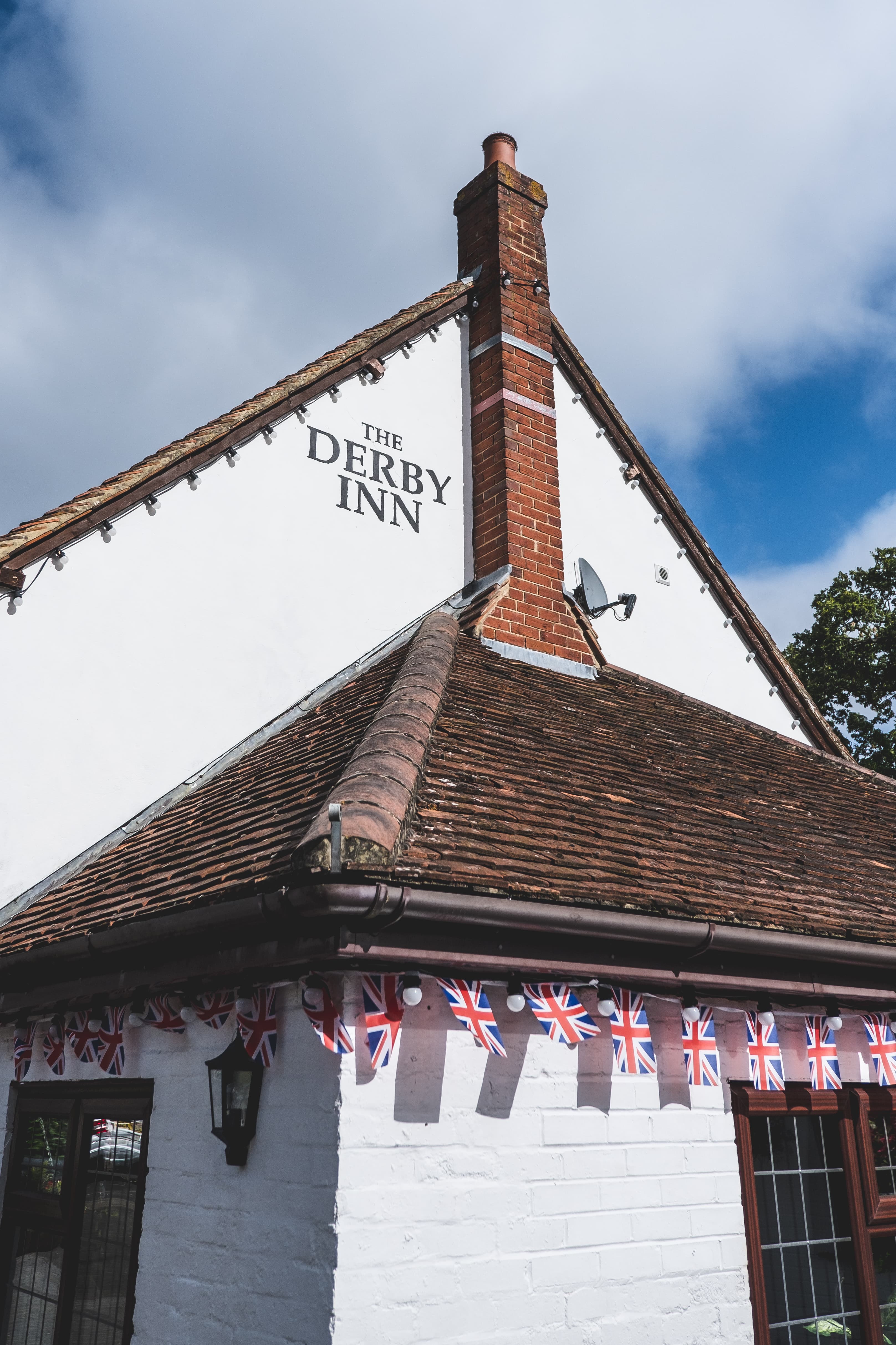 The Derby Inn side painted logo